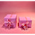 Pink wrapping paper and pink ribbon with tag (il-Milied it -Tajjeb)